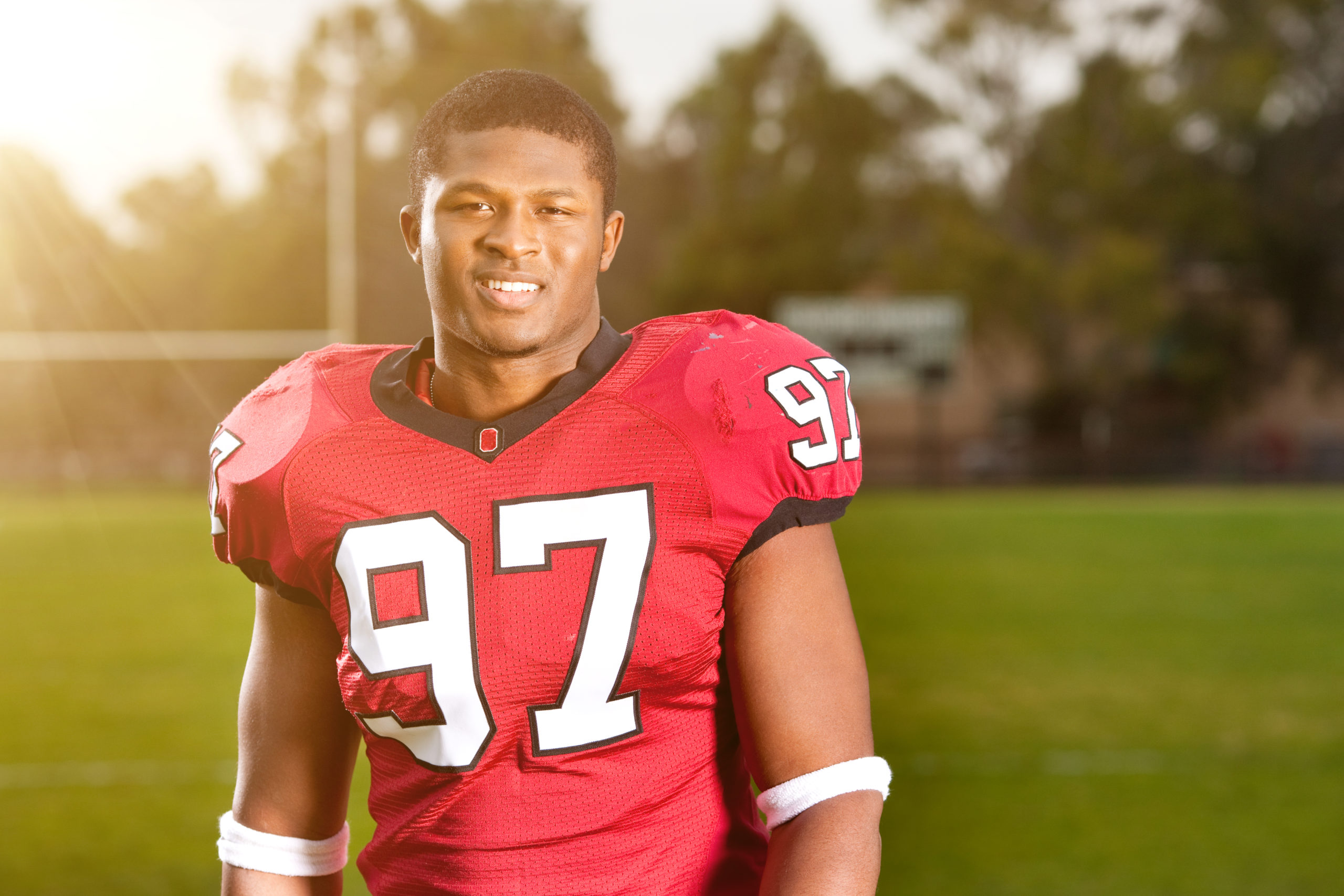 Sunlit Football Player Portrait
