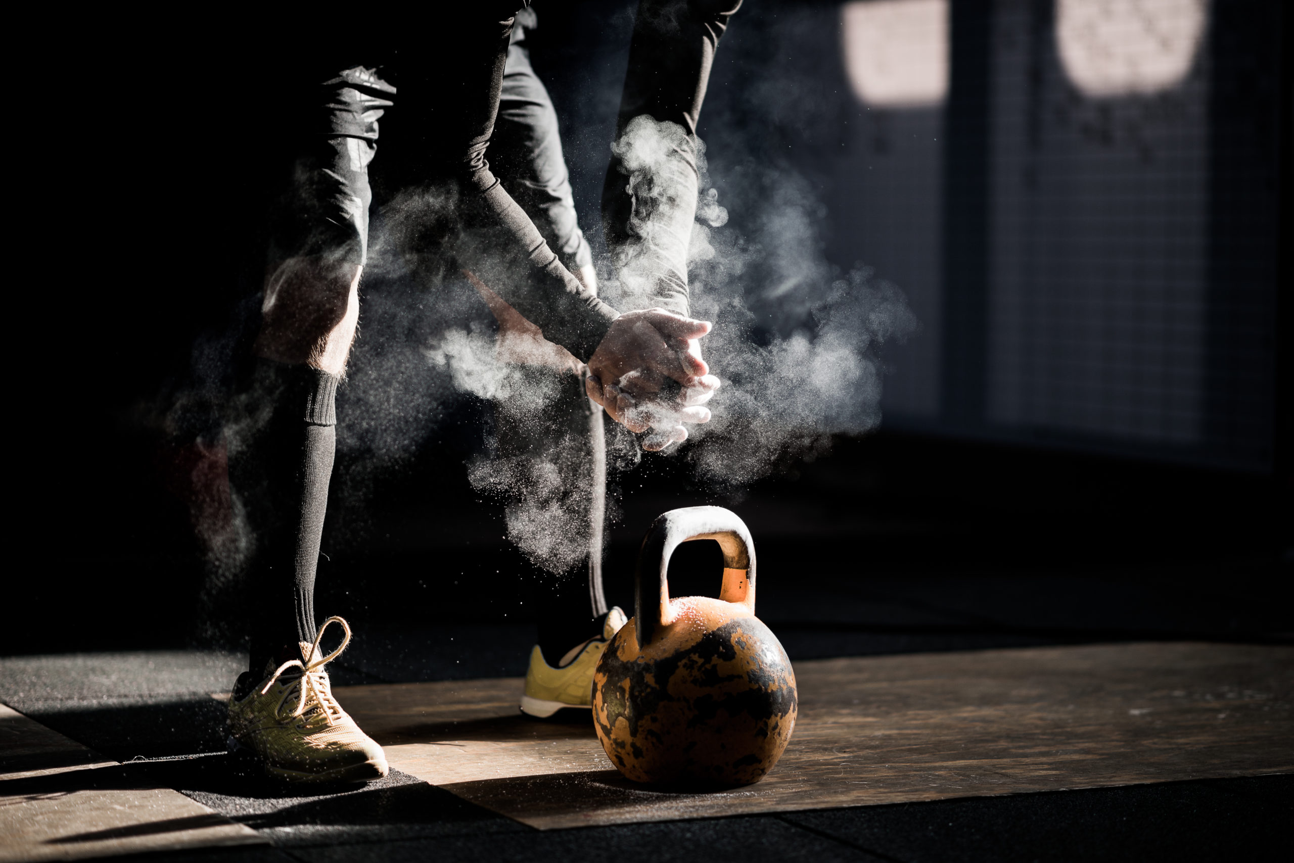 Gym fitness workout: Man ready to exercise with kettle bell